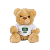 The College Football 2022 Teddy Bear from the College Football Ireland Store sits upright in a white T-shirt featuring the green and gold Aer Lingus College Football Classic logo, against a plain white background.